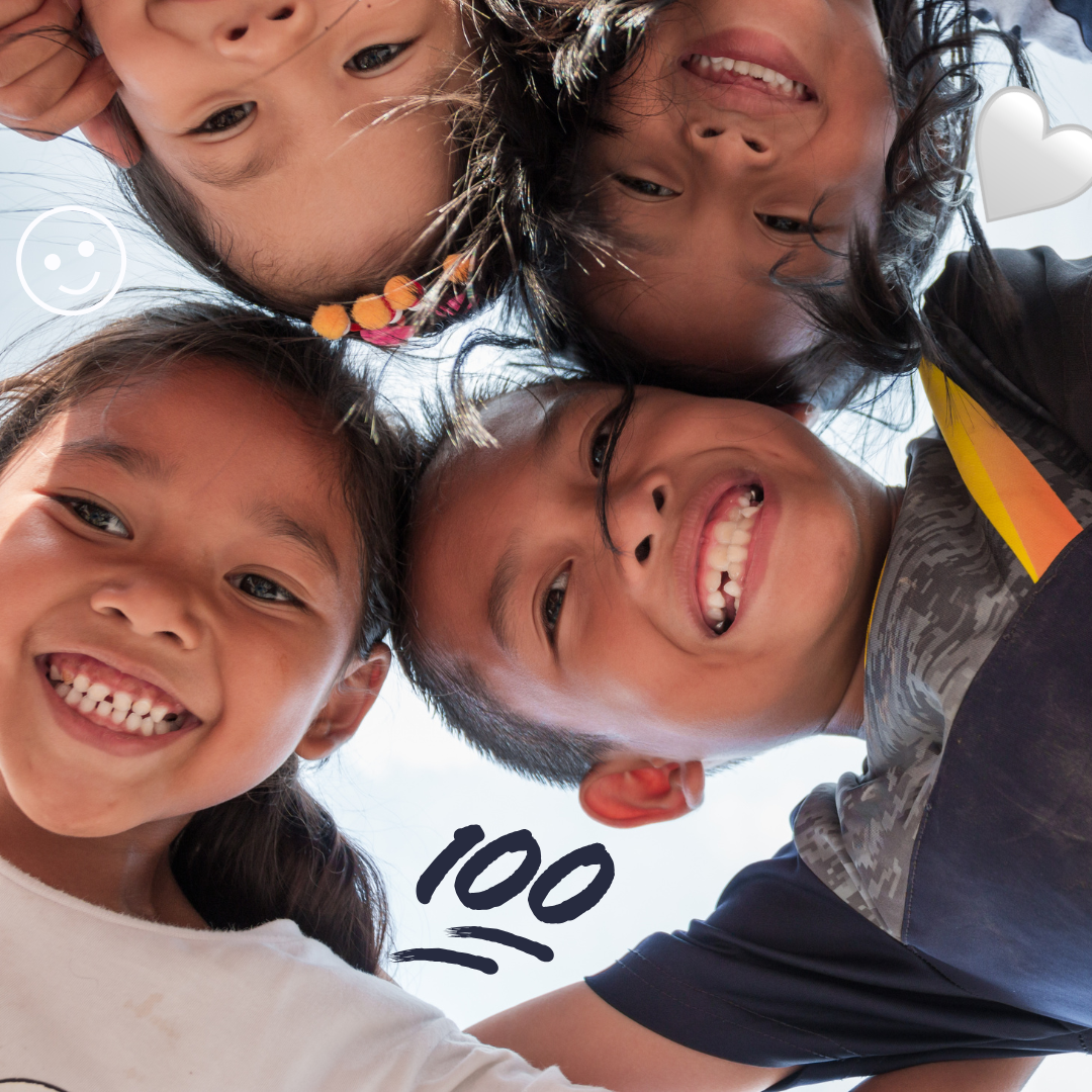 A group of children with the 100, smiley, and heart emoji